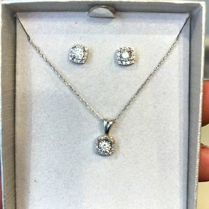 NWT 100% white gold, genuine diamond earring and pendant set.